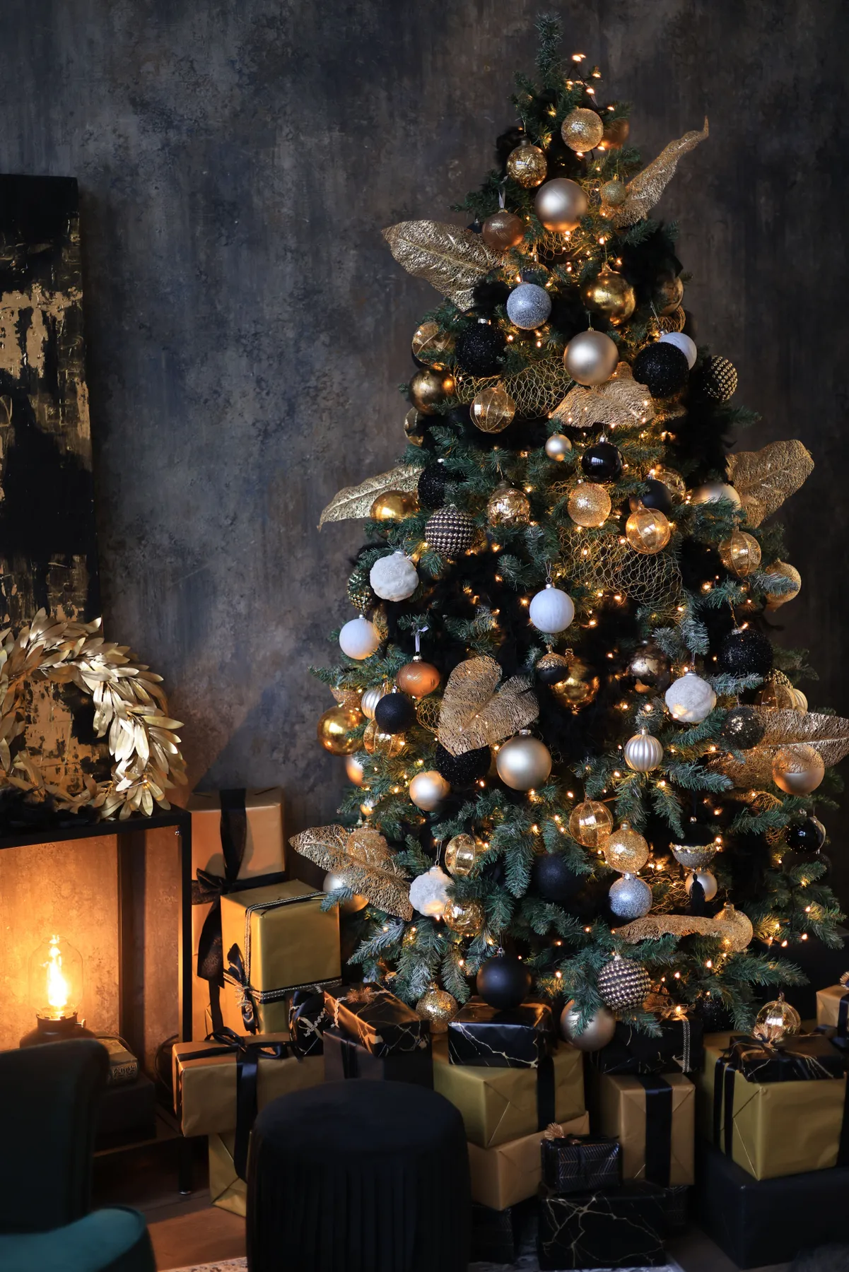 Beautifully decorated Christmas tree with elegant ornaments, lights, and presents in a cozy room.