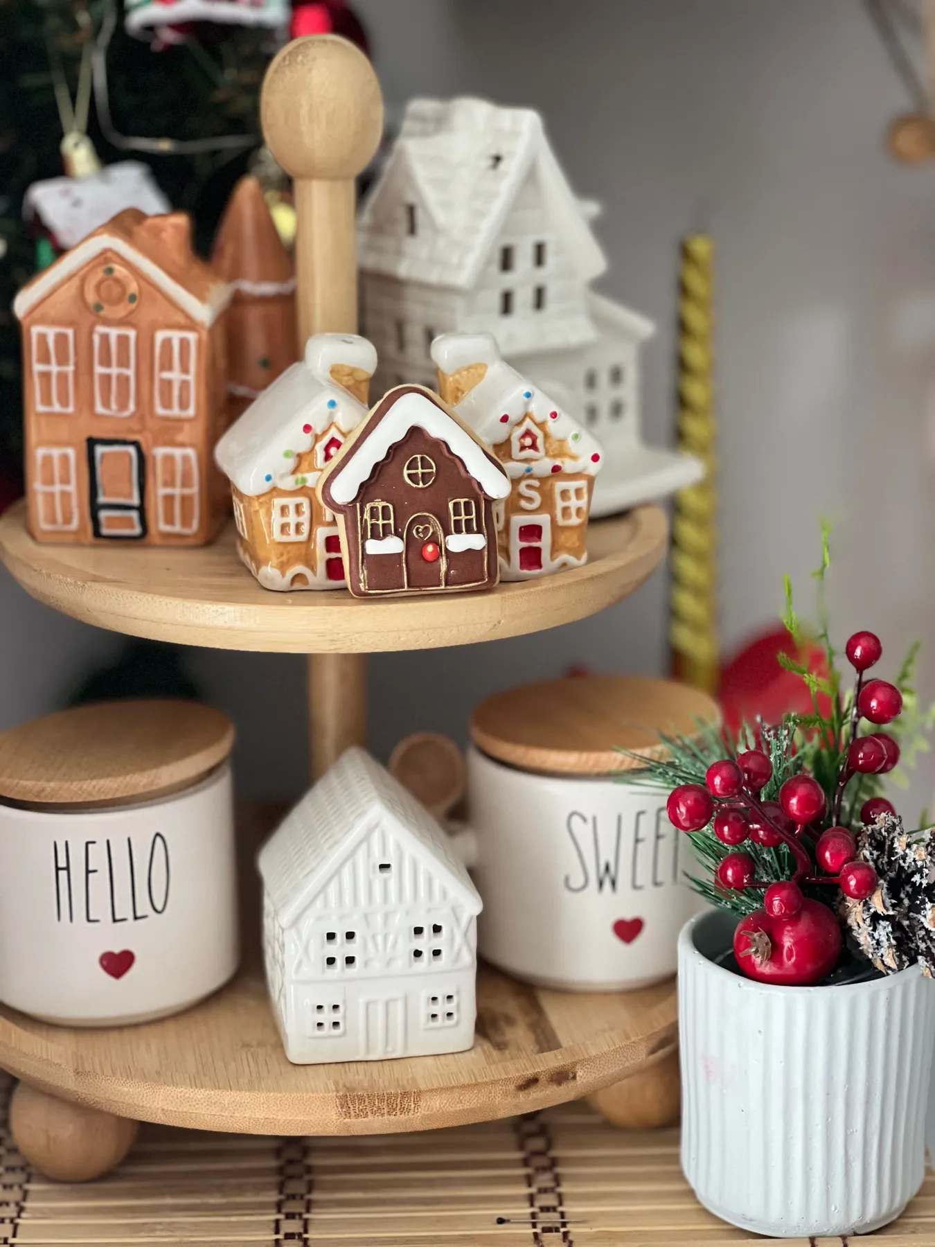 Charming gingerbread house display with festive holiday decor. Perfect Christmas ambience.