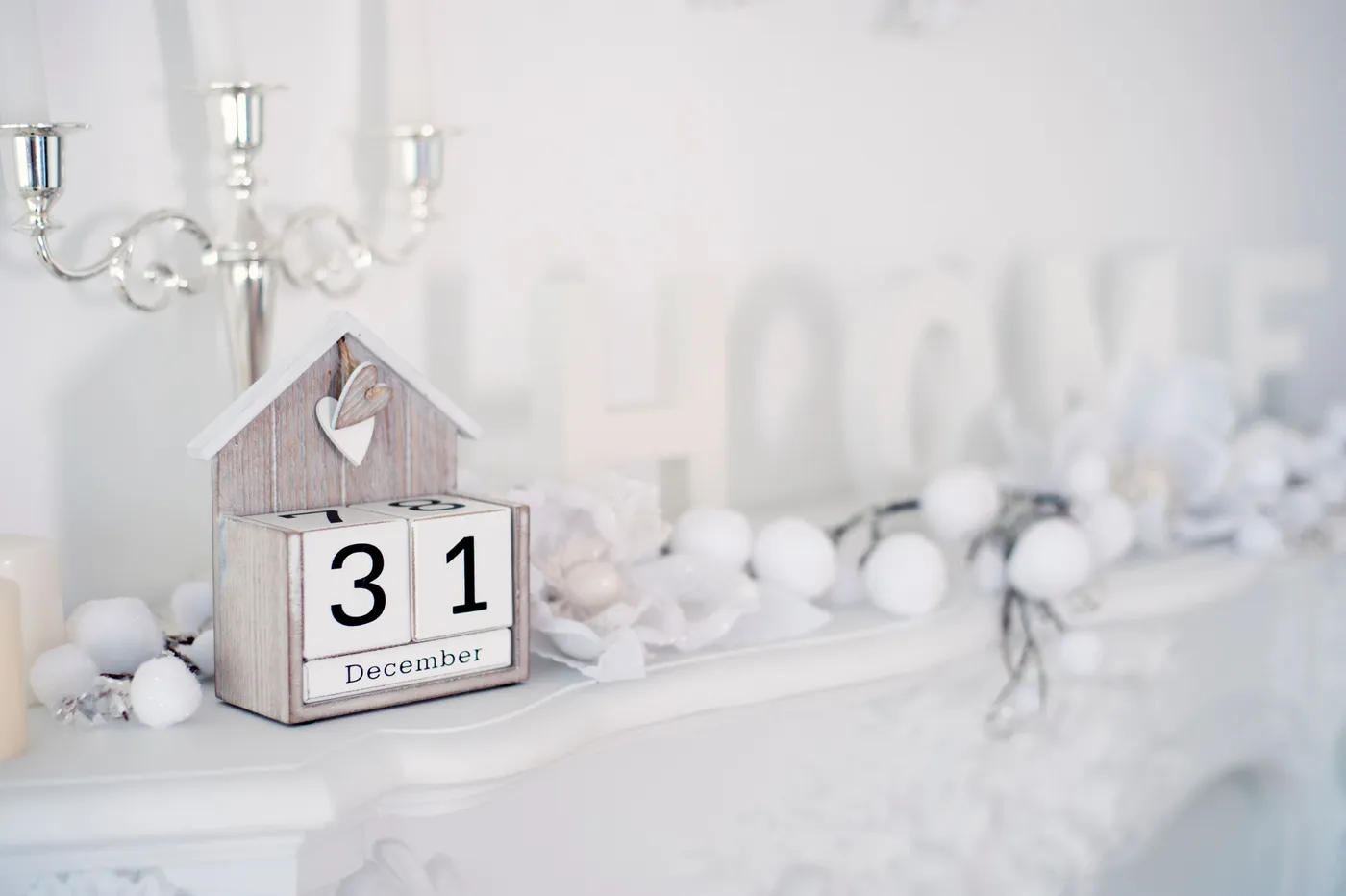 Charming holiday-themed decor featuring a December 31st calendar and white ornaments.
