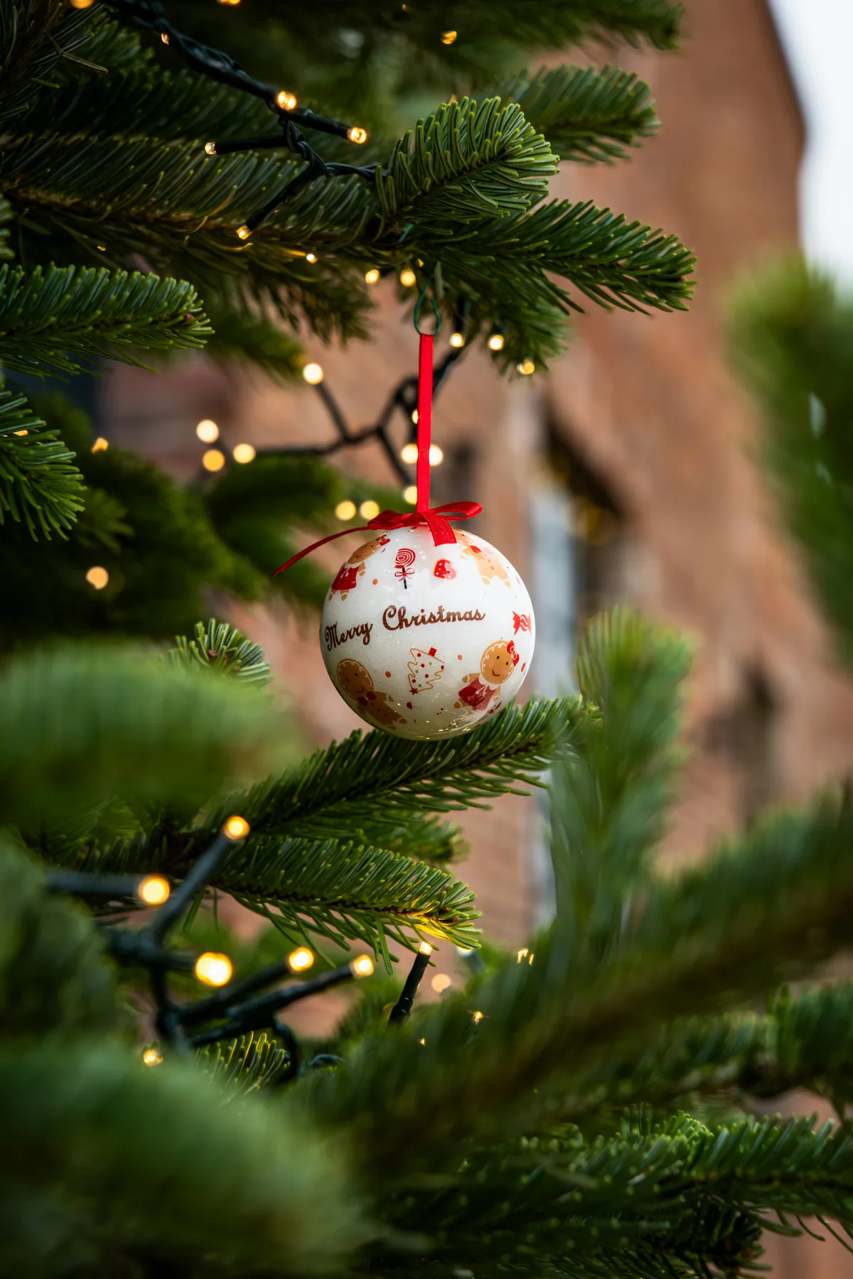 Christmas ornament hangs on a decorated tree - Free Photo on Unsplash
