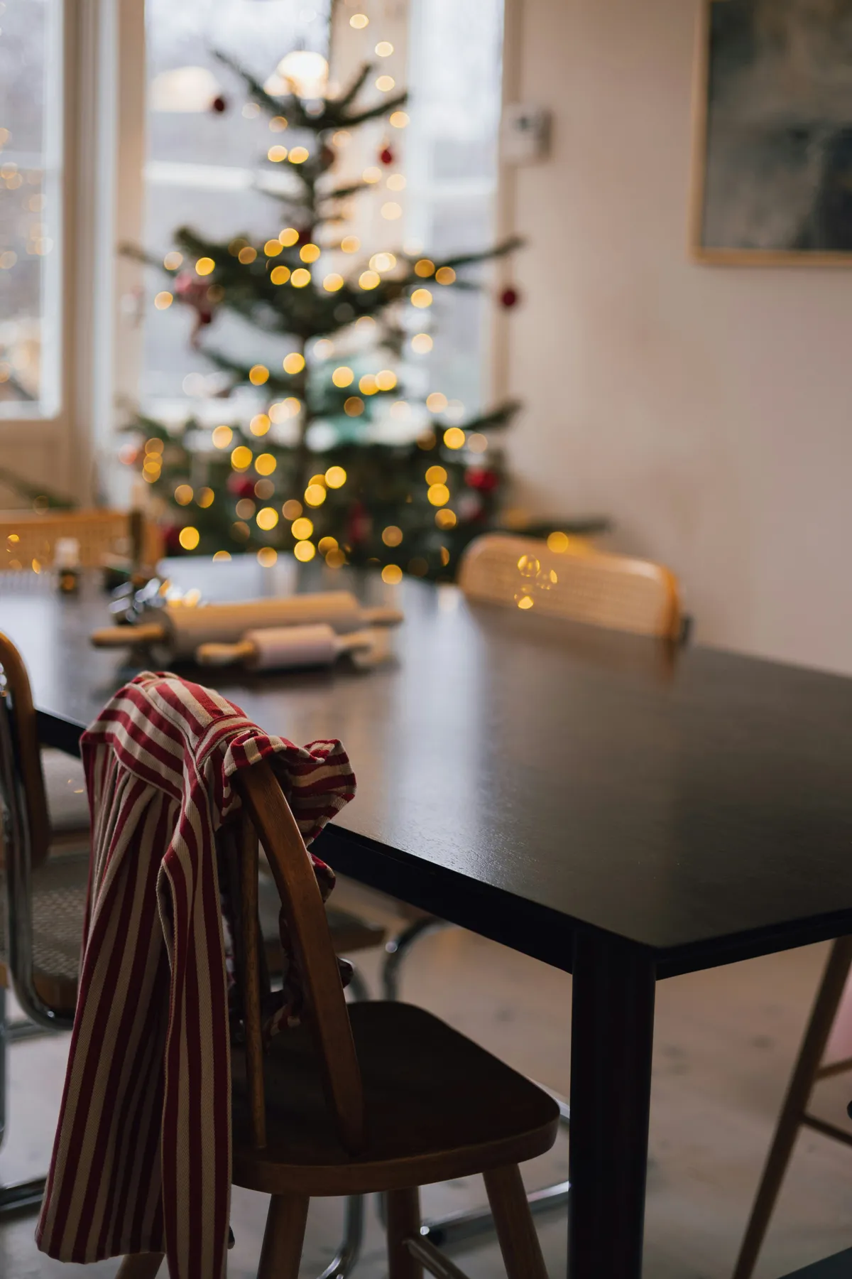 Christmas tree and dining table with striped cloth