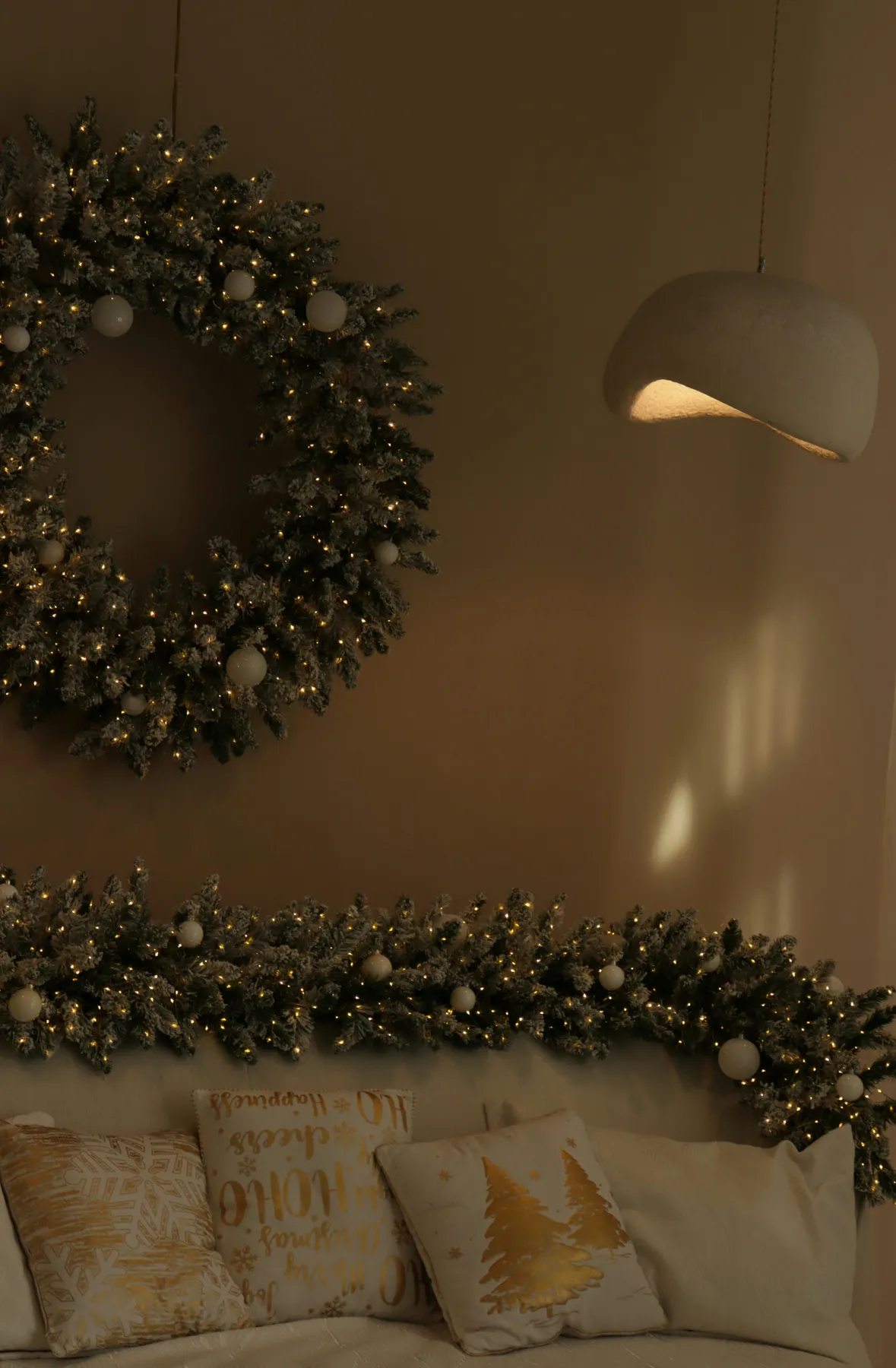 Christmas wreath and garland with festive pillows