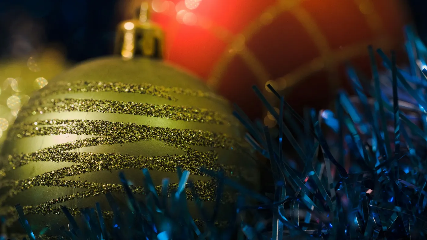 Close-up of festive christmas ornaments and tinsel