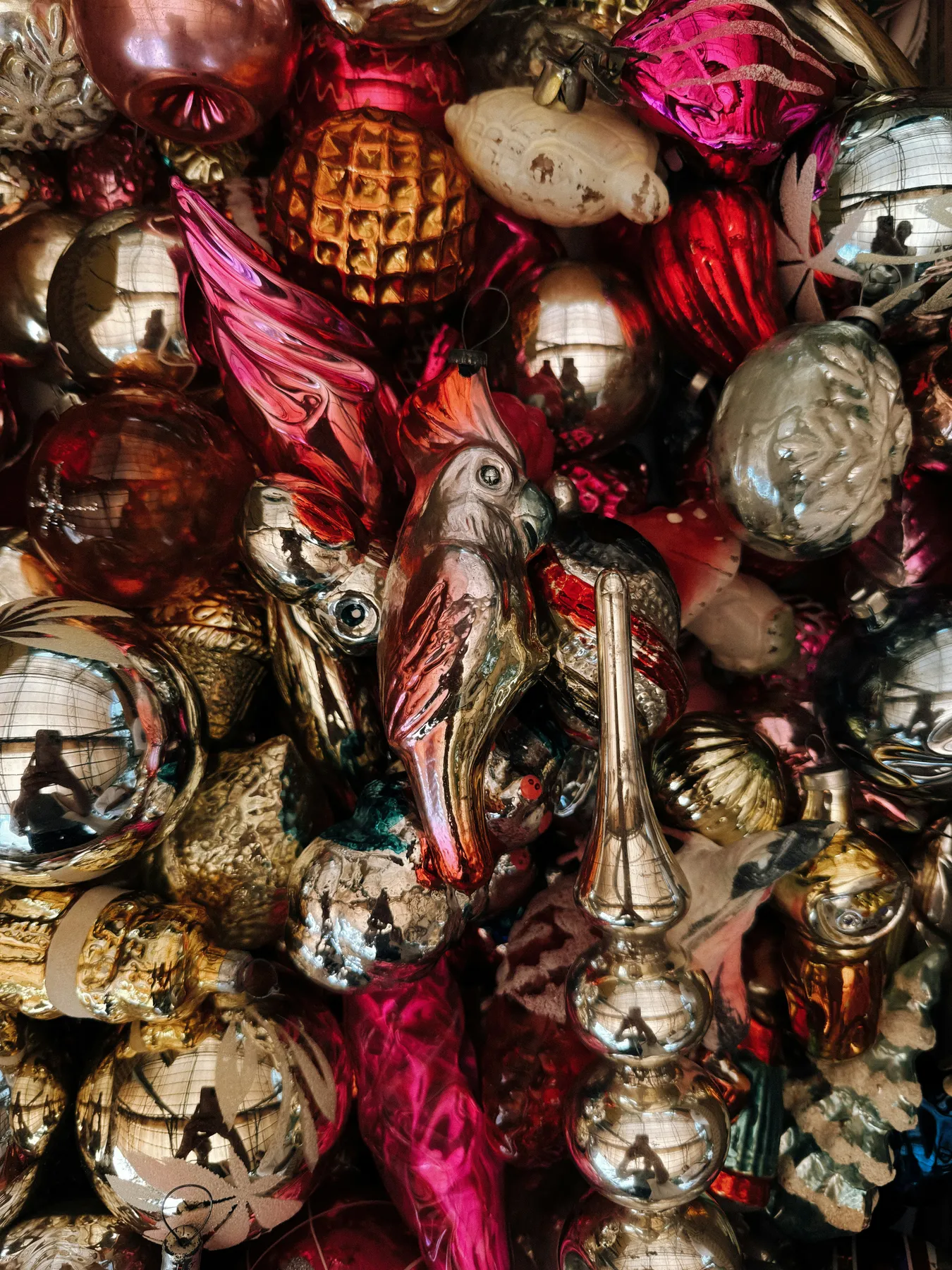 Collection of vintage christmas ornaments with various shapes and colors