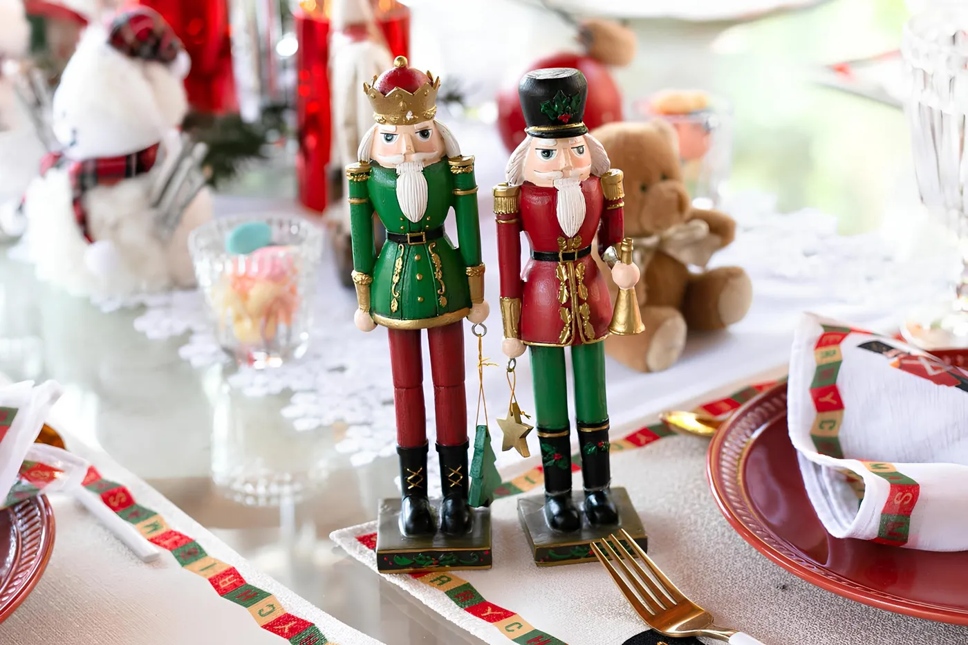 Decorative nutcrackers on a festive Christmas table setting with holiday elements.