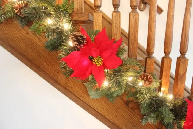 Easy and Inexpensive Christmas Stair Garland - Momcrieff