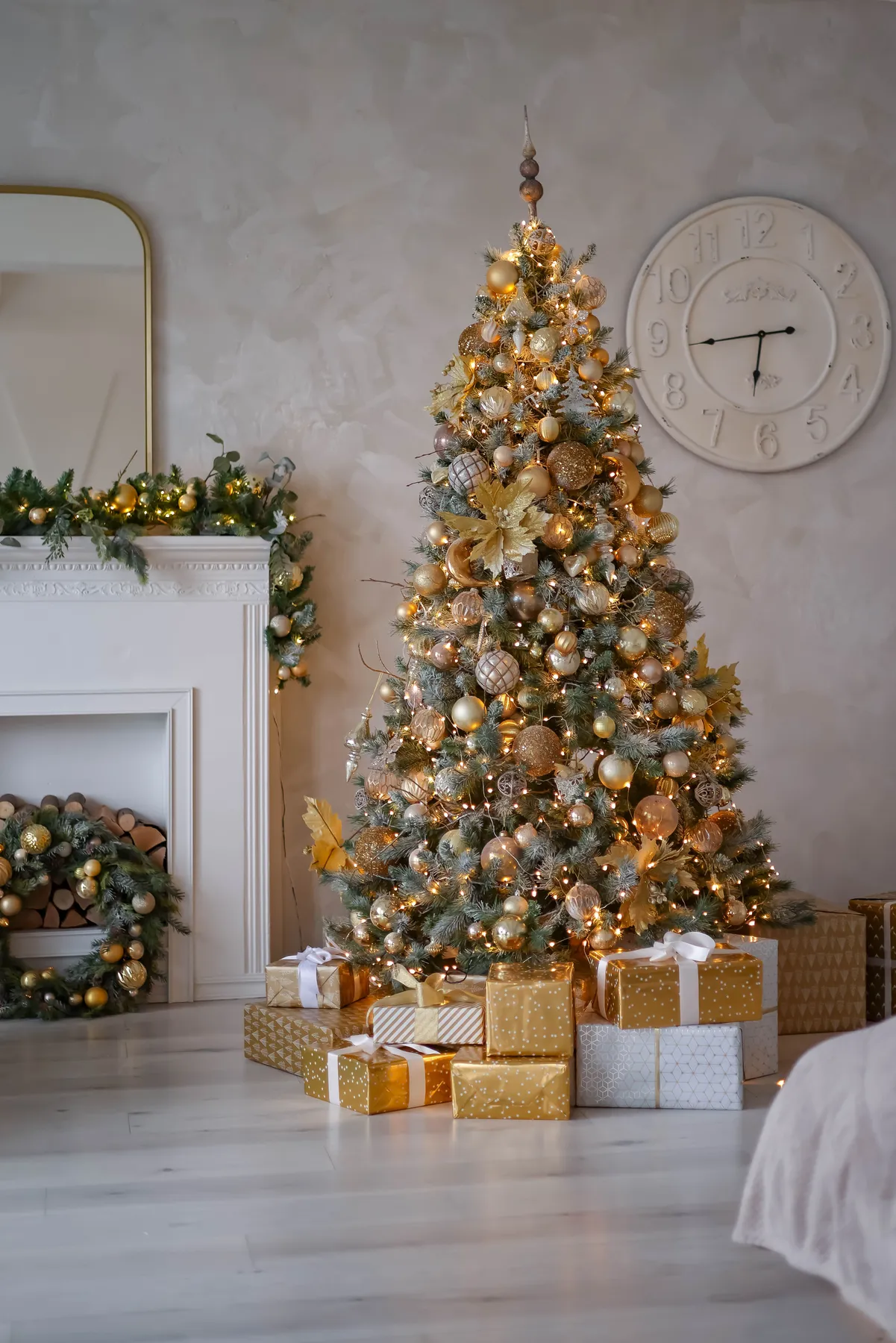 Festive living room featuring a beautifully decorated Christmas tree with gifts underneath.