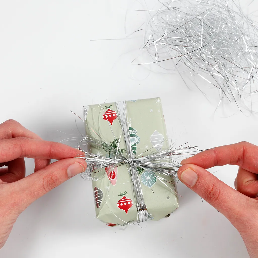 Gift wrapping with Christmas decorations