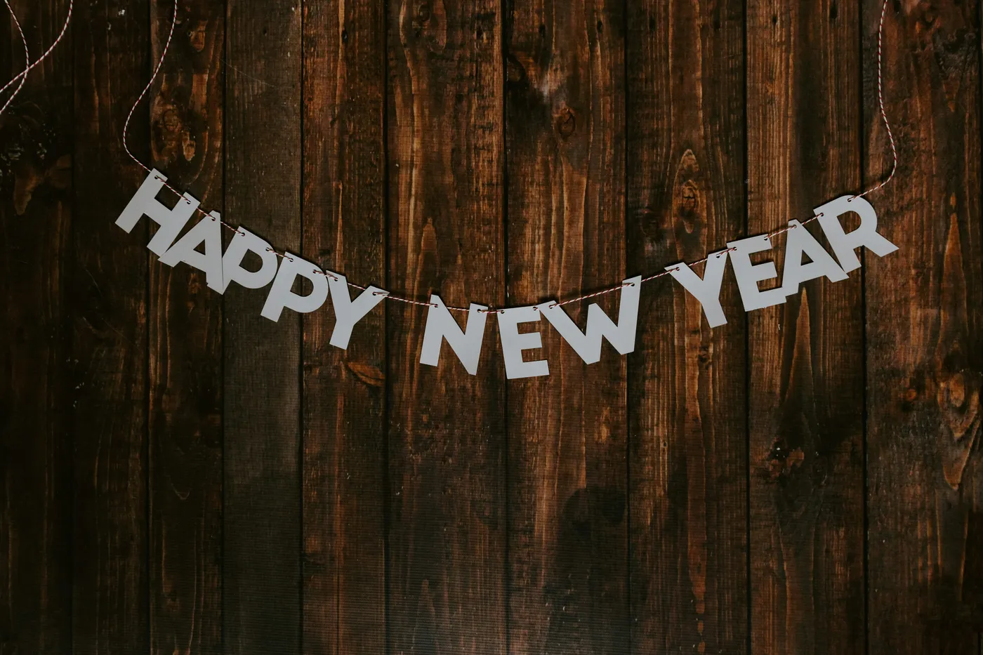 happy new year banner on a string