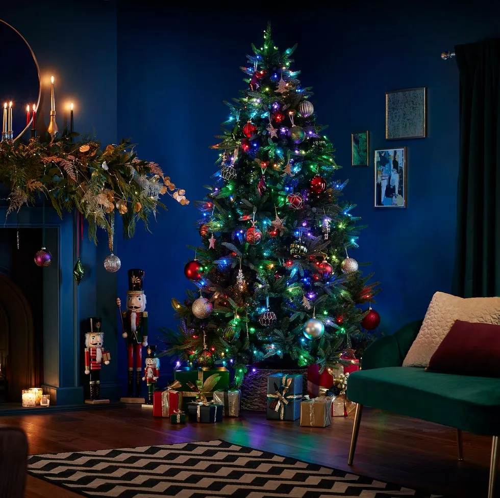 Traditional Christmas Tree With Colored Lights New Year`s Tree Decorated  With Garlands, Colorful Tree With