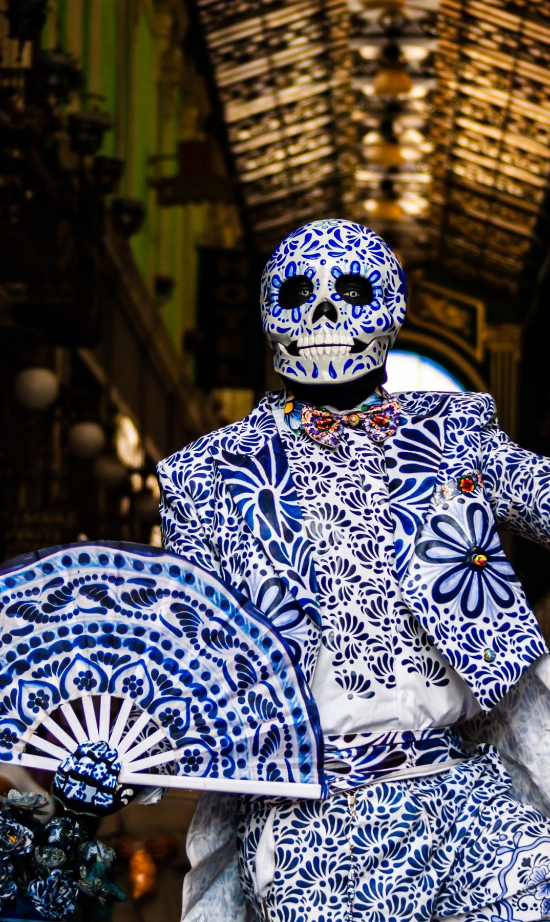 Vibrant Day of the Dead costume with floral patterns, Puebla, Mexico