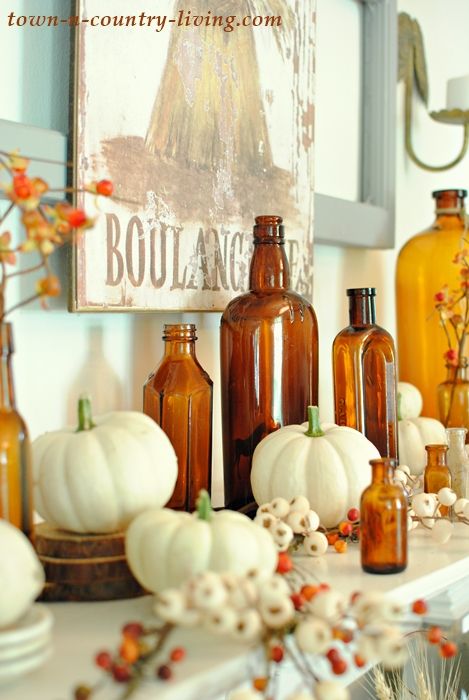 Vintage Fall Mantel with Brown Bottles - Town & Country Living