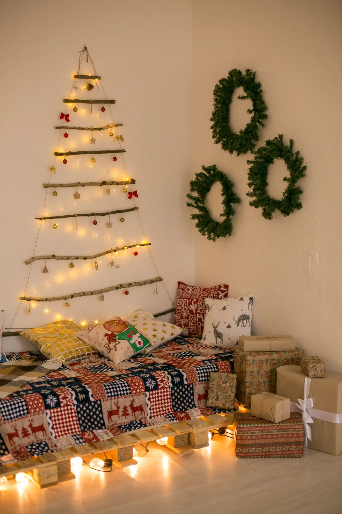 Warm interior with DIY Christmas tree, wreaths, and festive decorations.