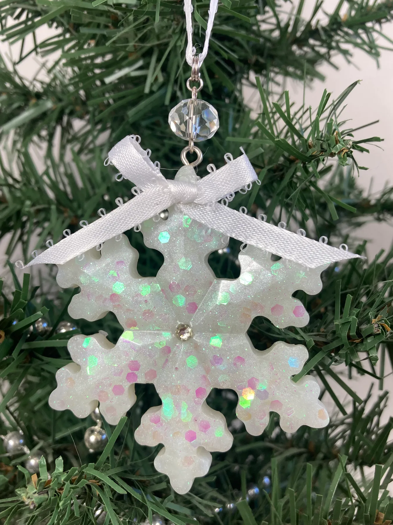 White Glitter Resin Snowflake Ornament with Clear Glass Bead and White Ribbon | faemoonwolfdesigns