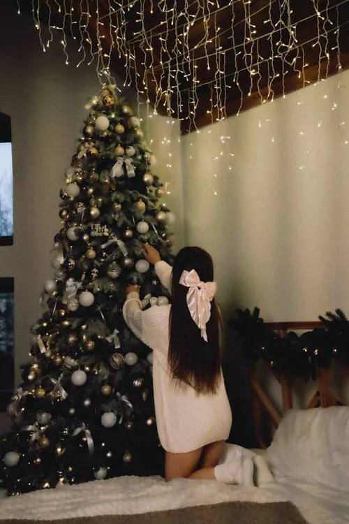 Woman Decorating Christmas Tree · Free Stock Photo